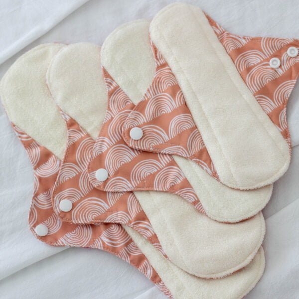Haliya Cup Reusable cloth pad or pasador 4 sizes from light to heavy flow. minimalist design. Organic Bamboo terry as surface layer and Printed PUL rainbow design